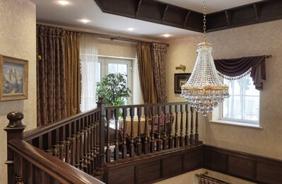 Chandelier above the staircase in country style EL741907